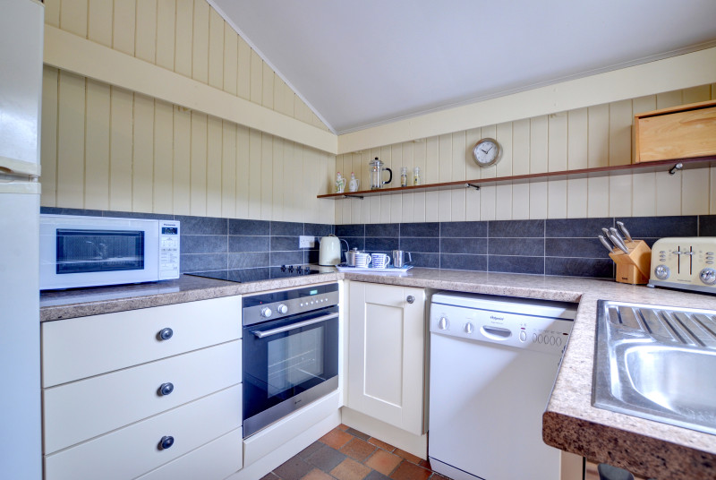 Compact fitted kitchen including dishwasher & fridge/freezer