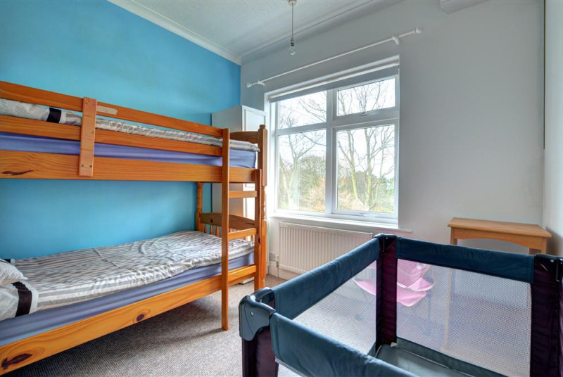 Twin room with bunk beds and views over towards Peasholm Park.