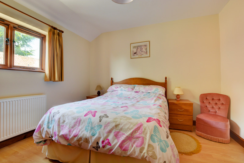 Charming double bedroom with a double bed