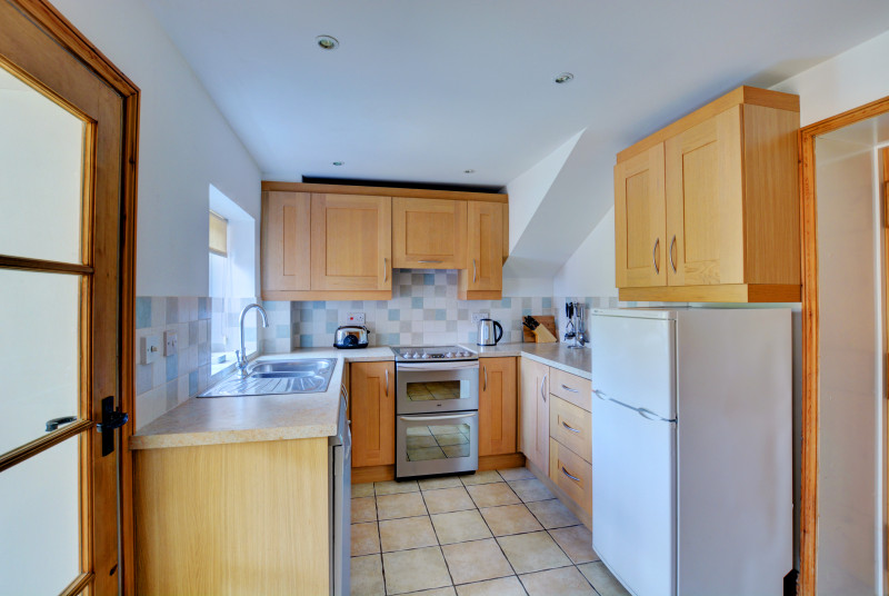 Modern, bright contemporary kitchen with the added bonus of a shared utility room and ground floor cloakroom