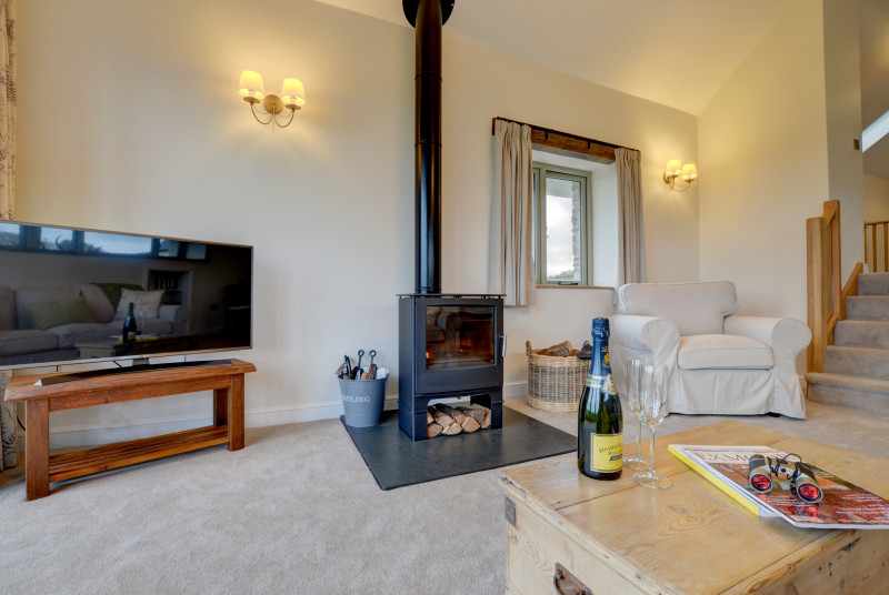 Enjoy a bottle of fizz whilst curled up on the sofa in front of the woodburner