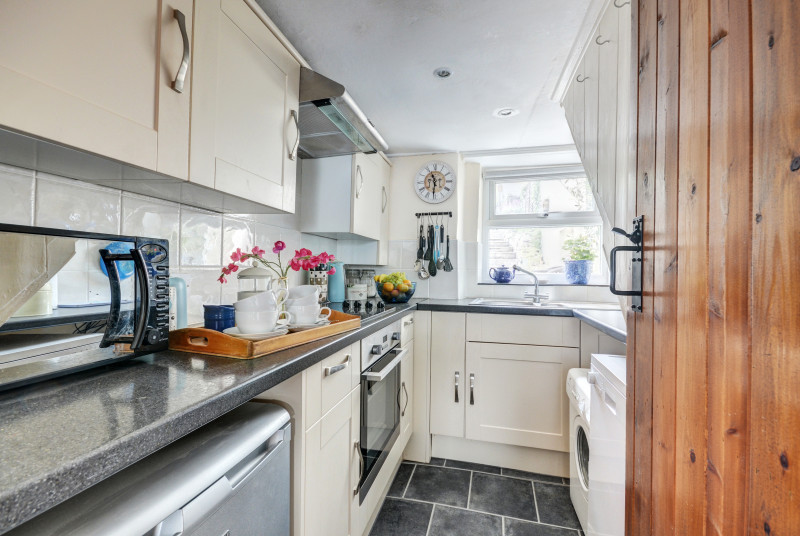 The compact kitchen provides all you will need for dining in