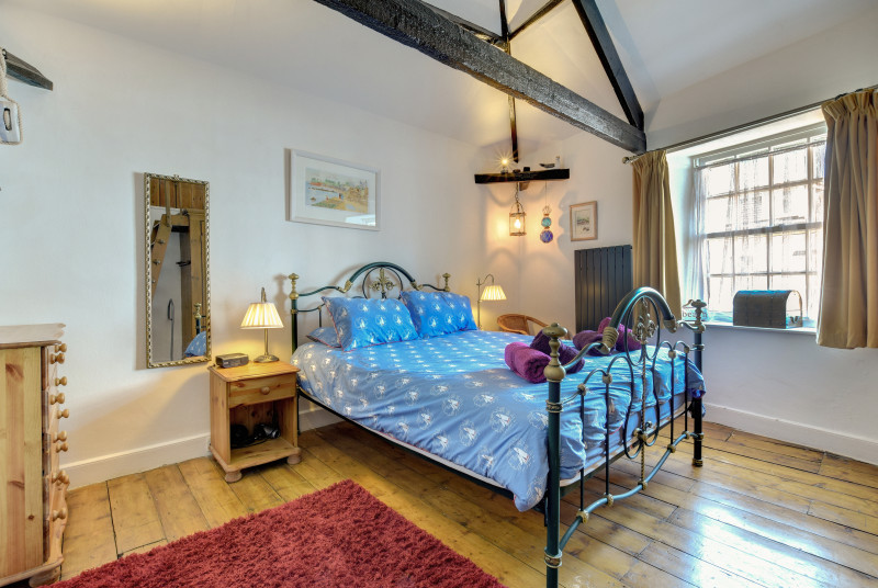 Master Bedroom: Double bed with underneath storage.