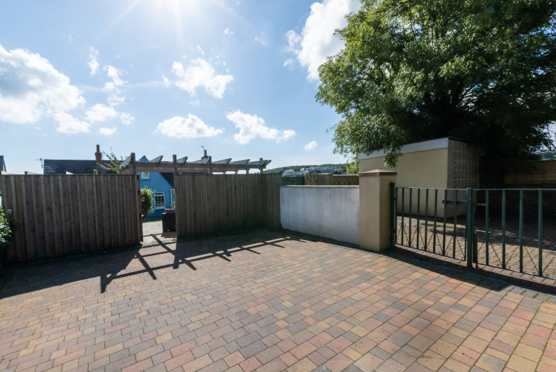 Car parking to the rear of Woodbine Cottage.