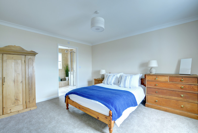 Stylish king sized double bedroom with en-suite shower room