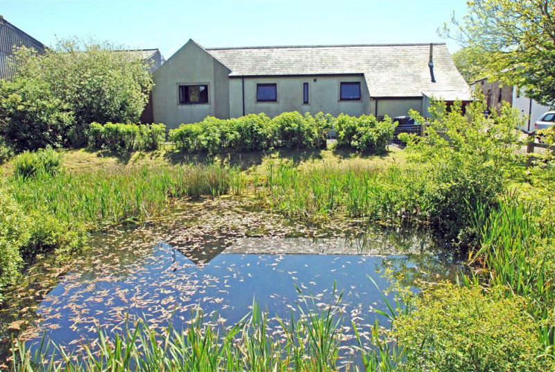 Pond in the garden to the rear of the property and 100 acres