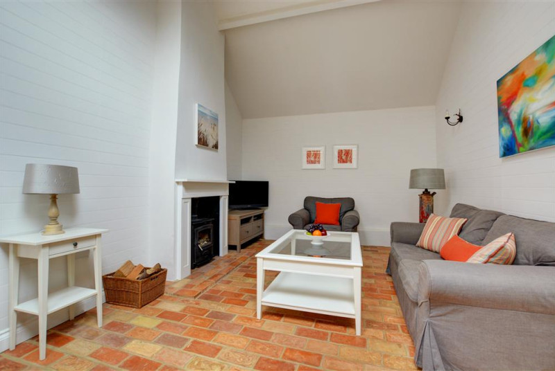 Sitting Room - comfortable seating, Sony HD TV with FreeSat, DVD player, video player, WiFi and woodburner
