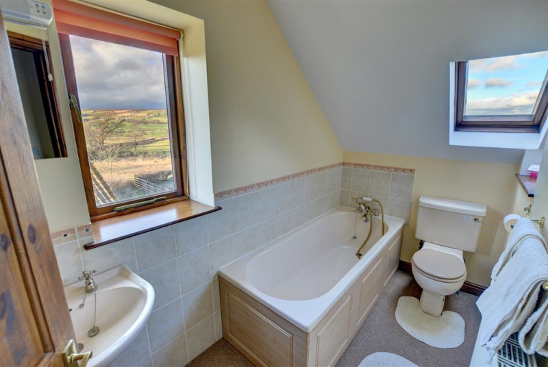 Bathroom has a bath and some great views!