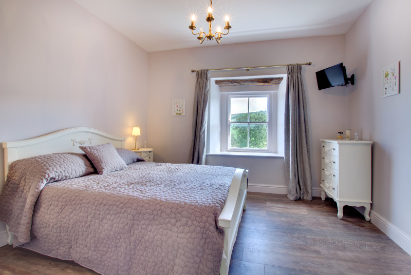 Master bedroom with wall mounted TV