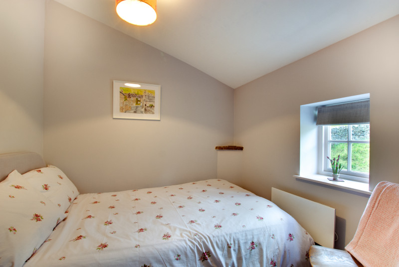 Large single bed in the second bedroom.