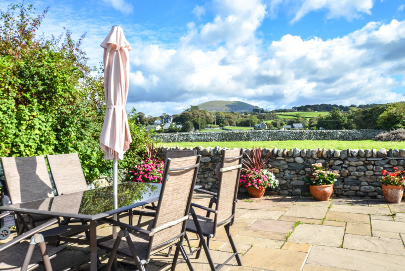 The patio are has lovely views over village and fields to the mountains