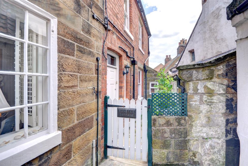 Minstead Cottage has two possible entrances. The door leading straight into the Kitchen is on the right.