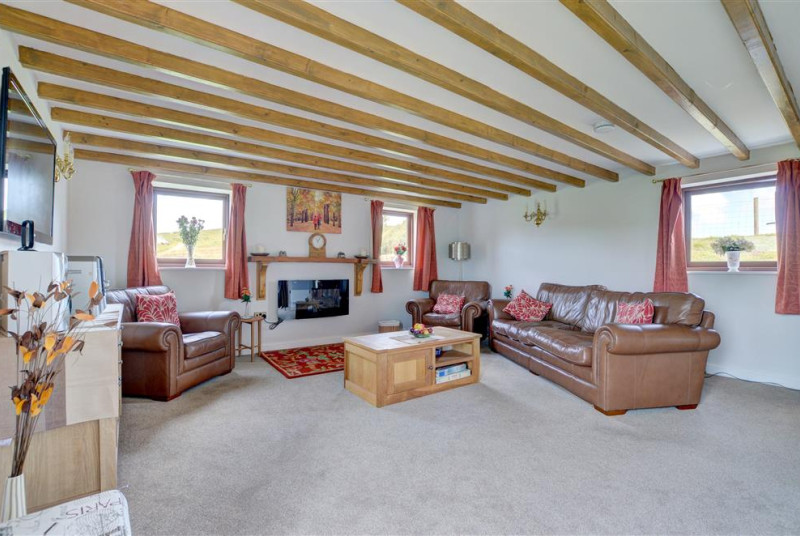 There is comfortable seating and modrn electric fire.