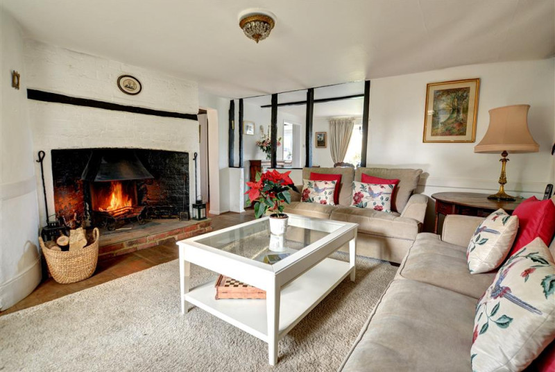 So stylish and welcoming with comfortable sofas around a wood burning stove