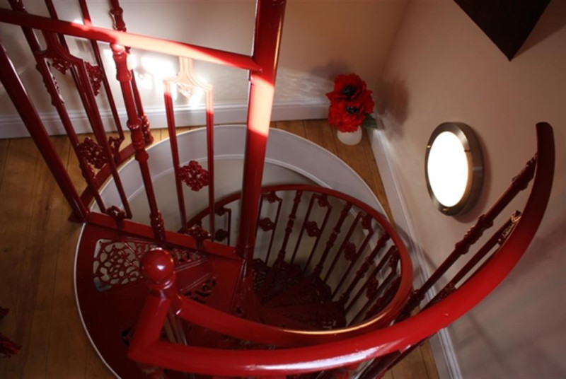 Feature spiral staircase leading to double bedded room only.