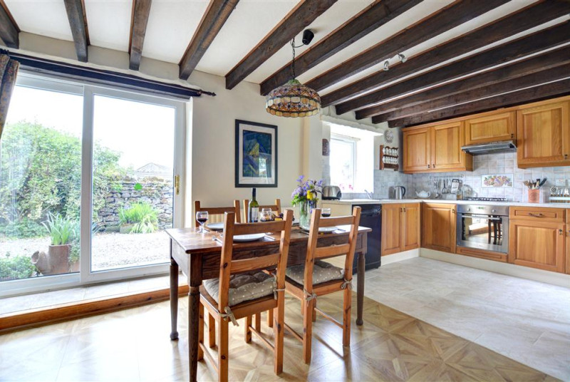 The dining area has lovely feature beams.
