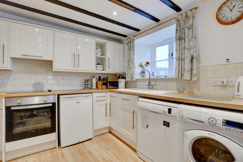 Kitchen with beamed ceiling and countryside views