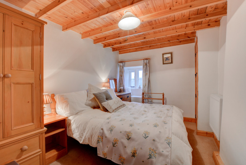 Bedroom two with double bed and countryside views