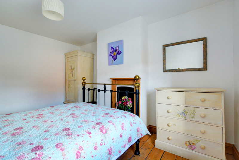 Charming double bedroom with delightful hand painted bedroom furniture