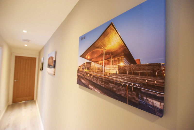Wall art in the hallway of Hafan y Ddinas Cardiff Apartment