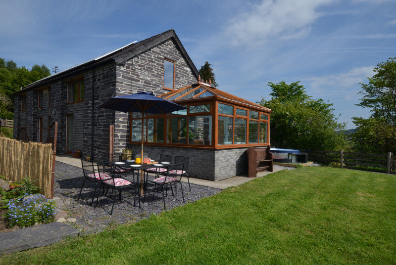 lawned area, hot tub and patio