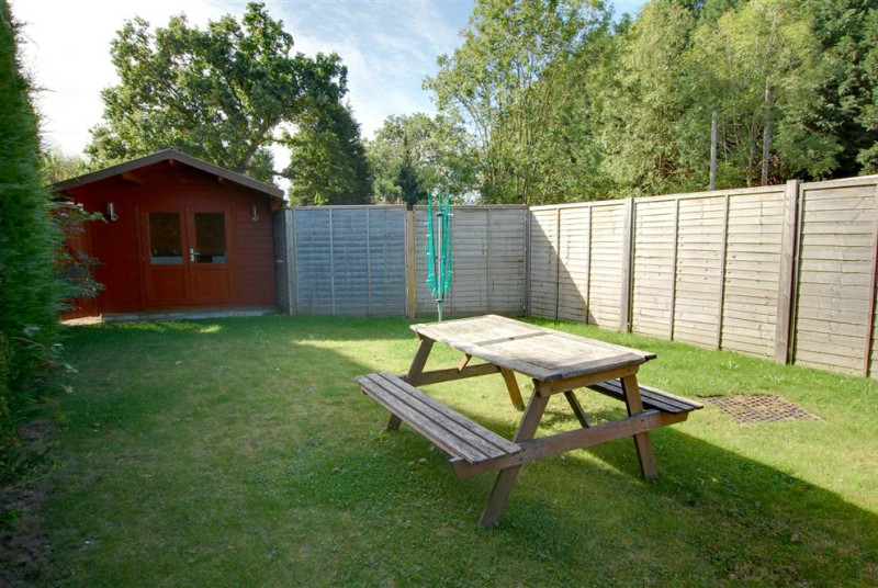 Utility room shared containing washing machine.