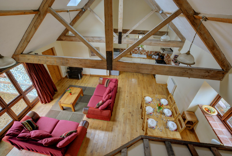 View from the mezzanine showing beams and the spacious open plan living area