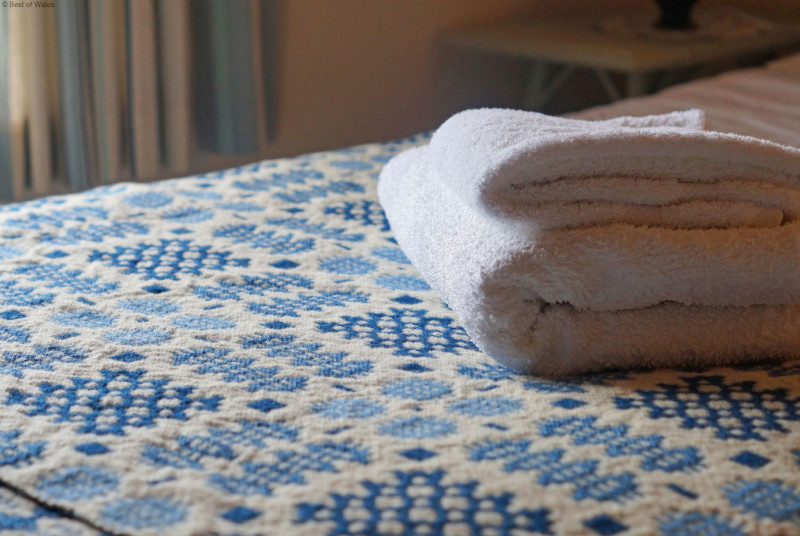 Family bedroom with double & single bed at this cosy, Welsh holiday cottage