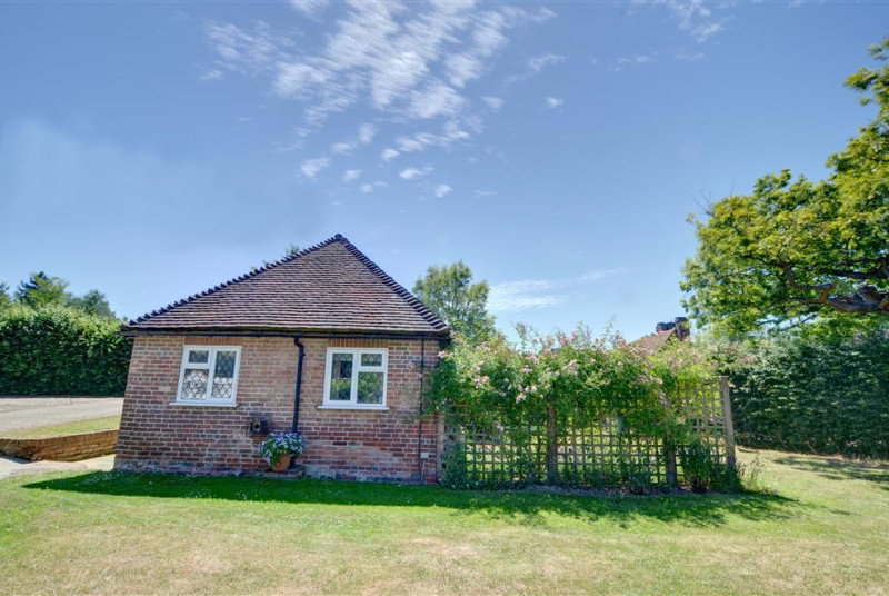 Side view of cottage showing entrance to the garden