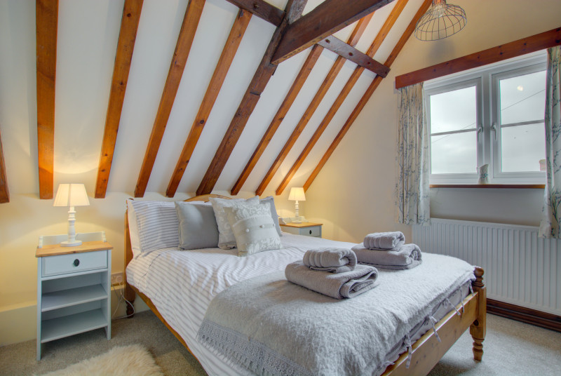 Main bedroom with lovely open beams and double bed
