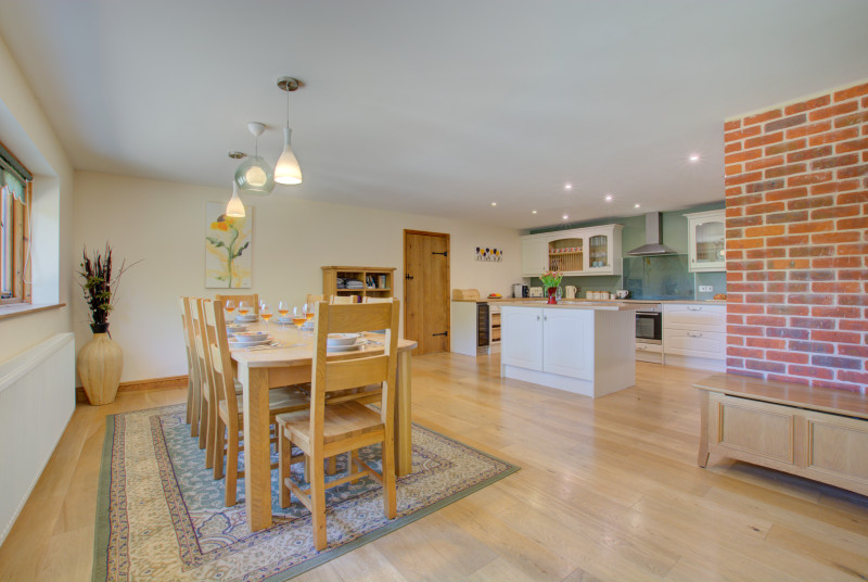 Large wooden table and chairs for dining in comfort.