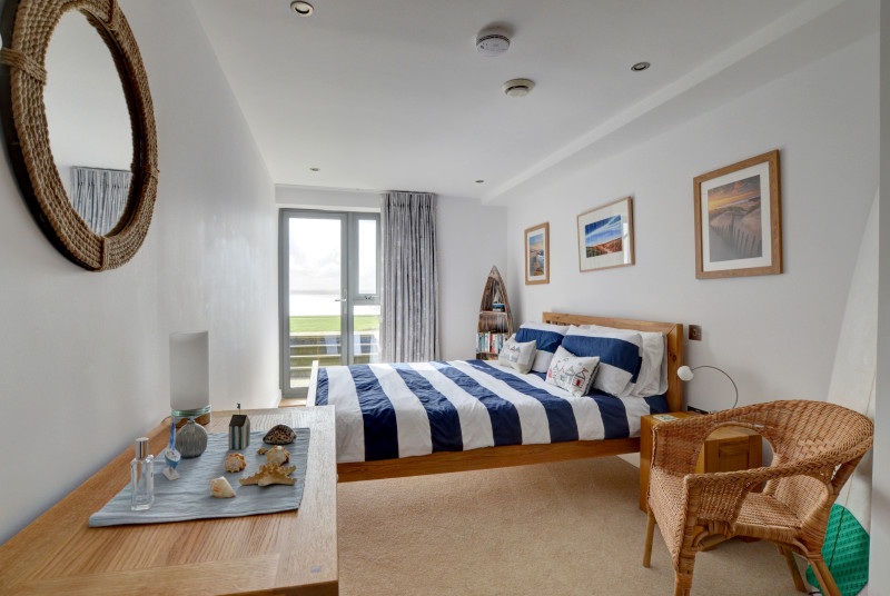 Airy master bedroom with patio door
