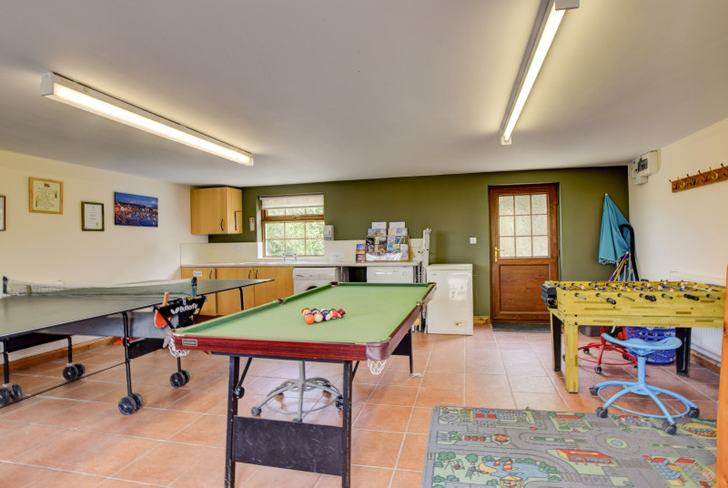 Large games room including snooker table, dart board & table tennis