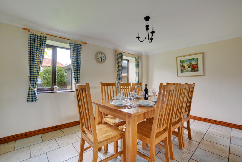 This lovely spacious dining room opens off the kitchen and is the perfect place for family meals