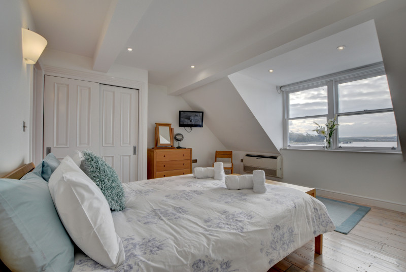 The master bedroom is on the top floor and has stunning sea views