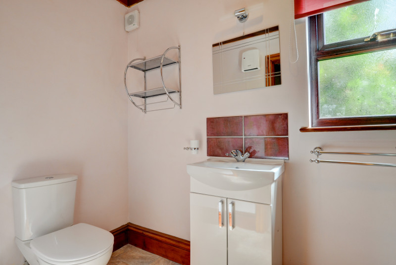 The bathroom with shower,basin and WC
