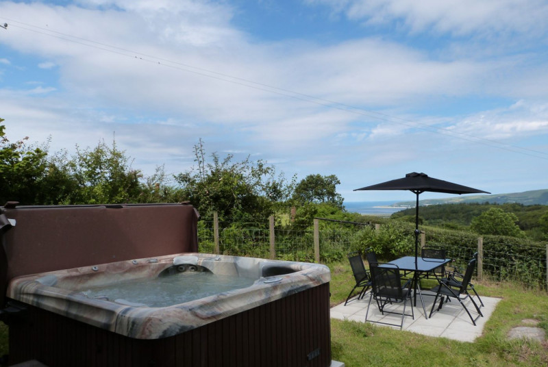 Sea and mountain views from this cottage with private hot tub