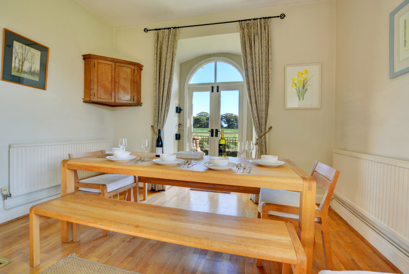 Light and airy Dining Area with table and chairs