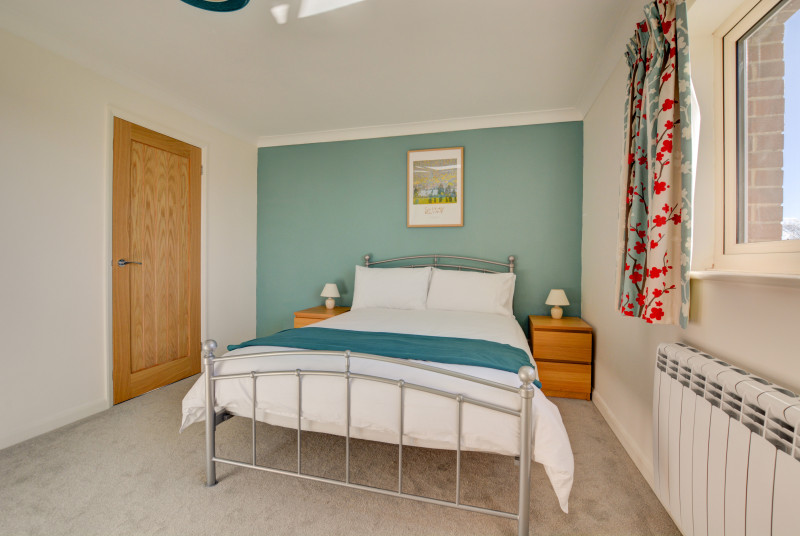 Bedroom 1 with full view of bed 