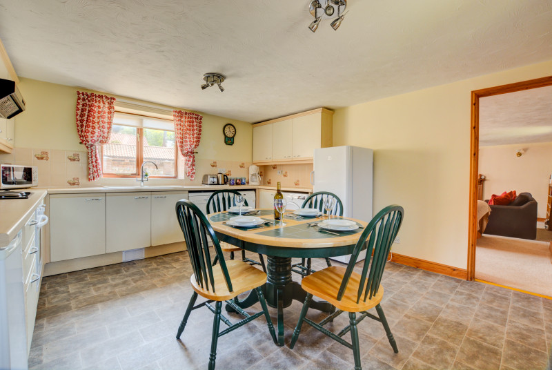 The spacious Kitchen/Dining Room has an electric cooker, dishwasher, washer/dryer, tumble dryer, combination microwave, fridge with icebox, bread-maker and coffee maker