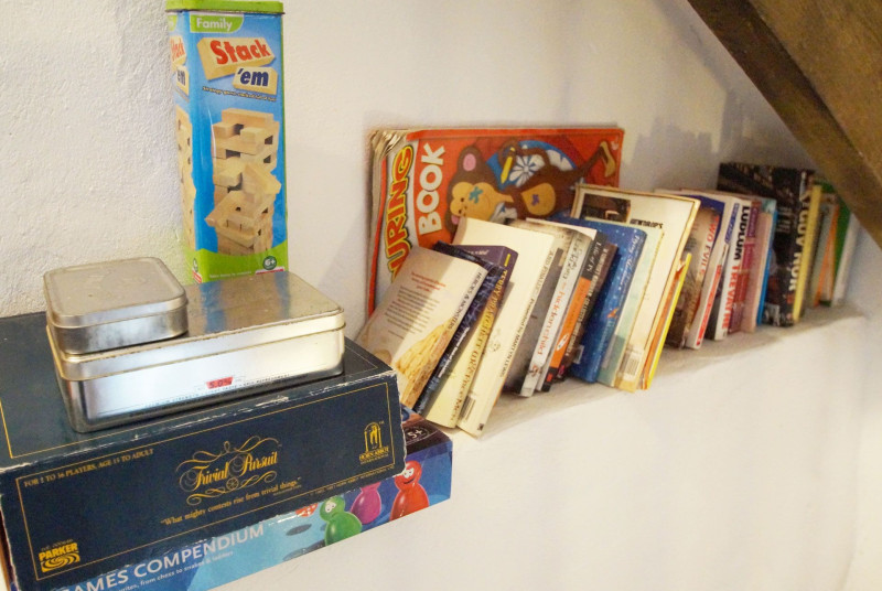 selection of books and games at the cottage