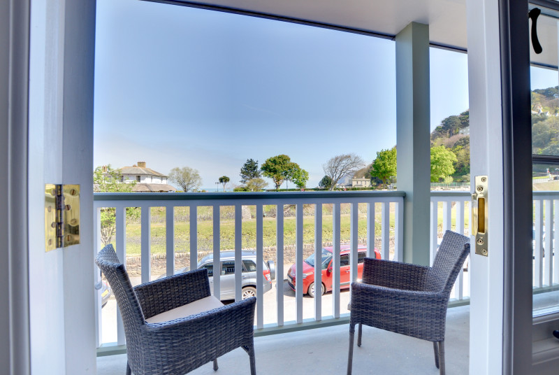 The large balcony provides a perfect place for breakfast, informal dining and enjoying a glass of wine whilst taking in the beauty of the surroundings