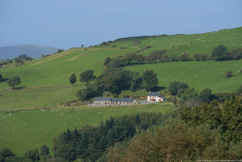 Two 5 star holiday cottages and the owners's farmhouse in a lovely setting. Photo by Storm Development