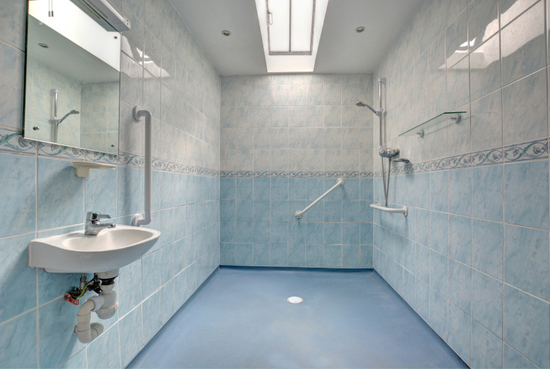 Modern shower/wet room with wheel-in shower, washbasin and wc - equipped for the less able 