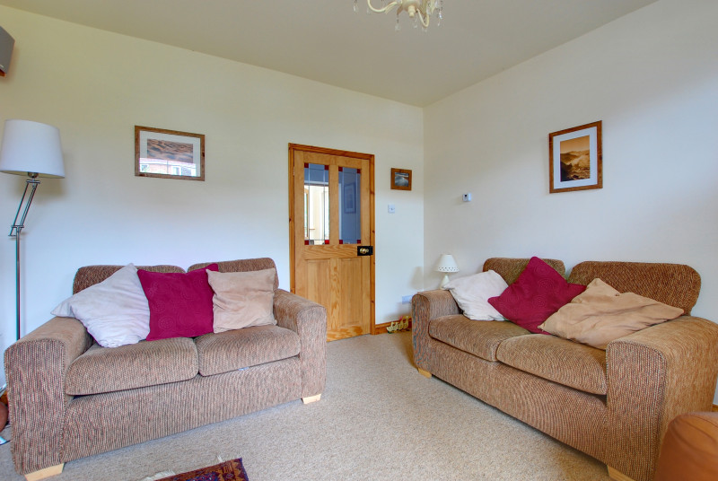 The two comfortable sofas in the sitting room provide a perfect family room
