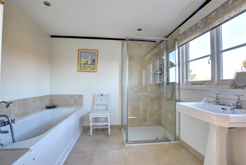 Tiled and modern bathroom with far reaching views