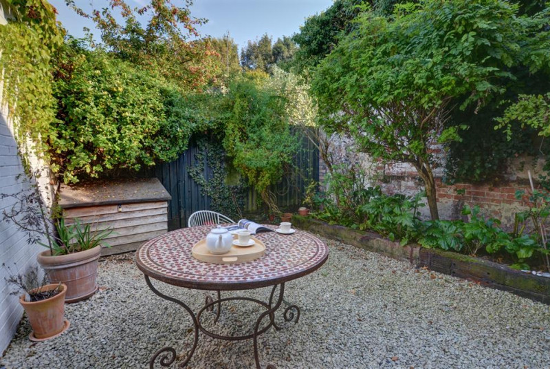 Enjoy this courtyard garden for a good book in the sunshine or an alfresco meal or two.