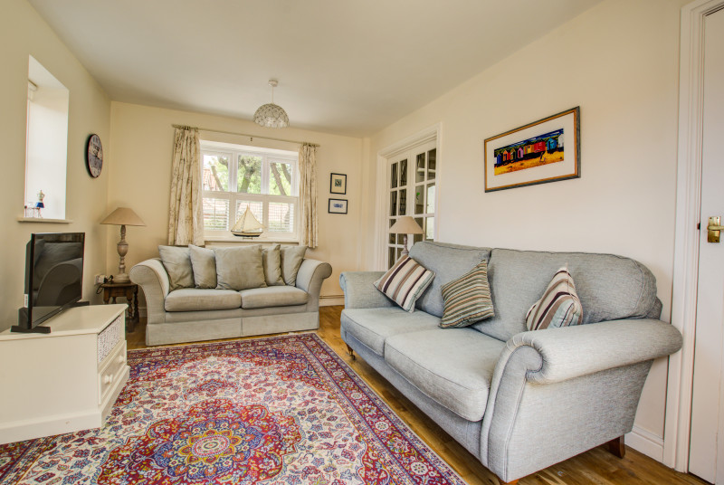 A cosy sitting room with two large sofas