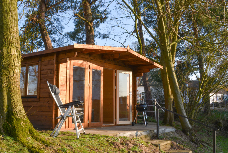 Summer House overlooking the Mill Pond with outside furniture and barbeque