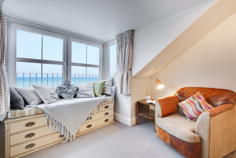 Master bedroom with window seat & sea views 
